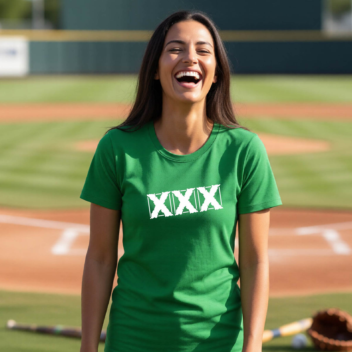 A woman laughing on a baseball field wearing a bright green t-shirt with the Roman numeral 'XXX' printed in white across the chest.