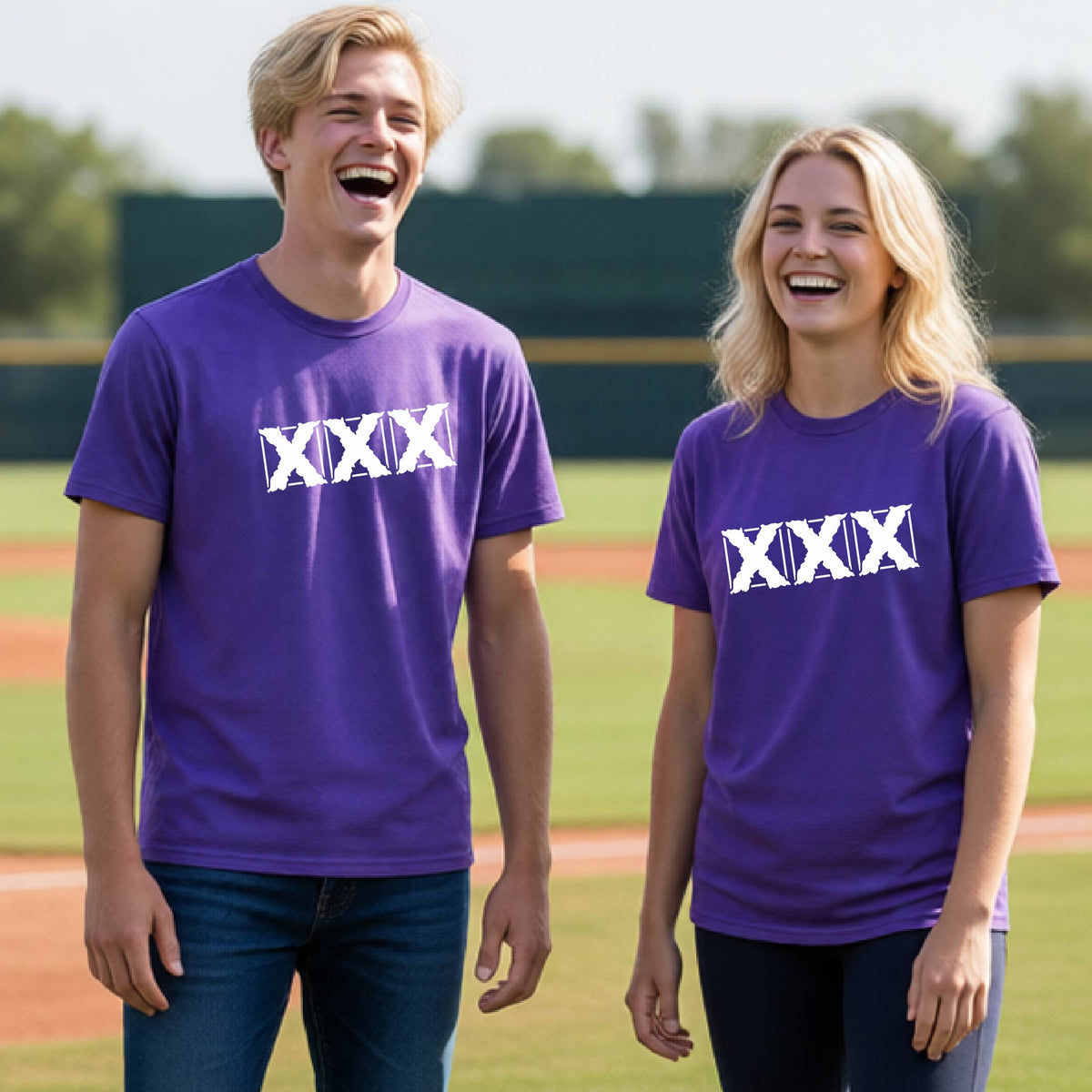 Two teenagers standing on a baseball field wearing matching purple short-sleeve shirts with a white letter logo 'XXX' graphic across the chest.