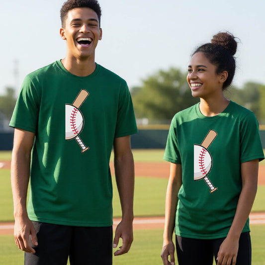 Two youth athletes wearing matching shirts, smiling in front of a baseball diamond wearing green long-sleeve t-shirts, with a colorful graphic of a half baseball with a curved bat behind it, printed on the front of the shirt. 
