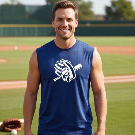 A man smiling in front of a baseball diamond wearing a royal blue sleeveless t-shirt with a white graphic of baseball mitt, bat and ball, printed on the front.