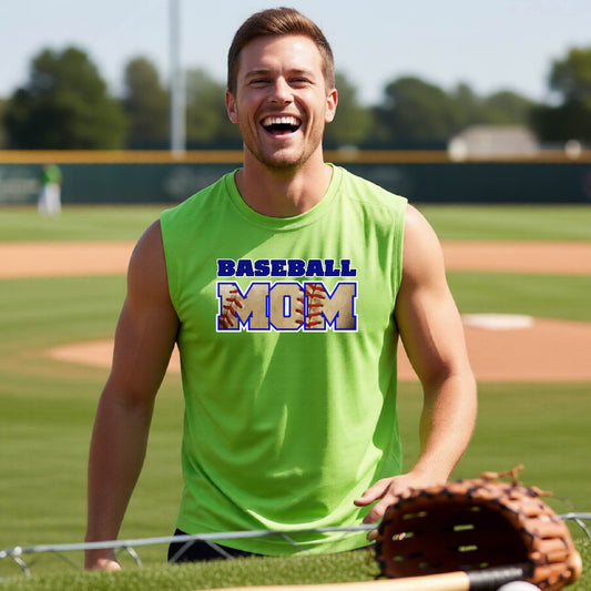 A man smiling in front of a baseball diamond wearing a lime green sleeveless t-shirt with a colorful graphic of the words ‘BASEBALL MOM’ printed on the front.