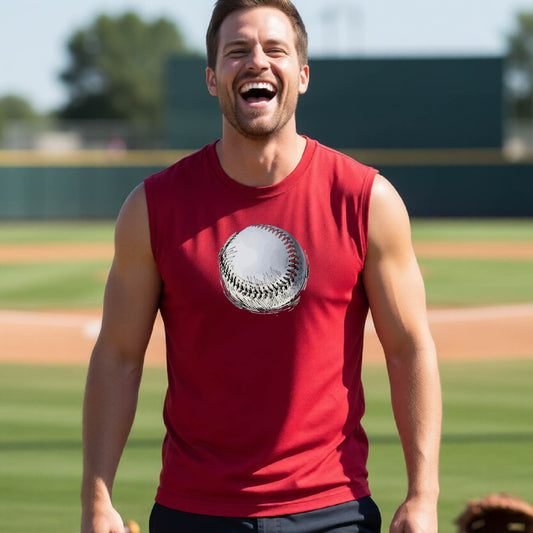 A man smiling in front of a baseball diamond wearing a red sleeveless t-shirt, with a white and red graphic of an outline of a sketched retro baseball, printed on the front.