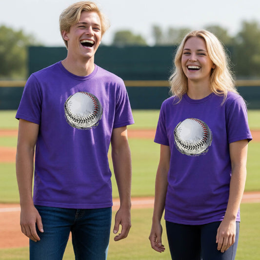Two youth athletes wearing matching shirts, smiling in front of a baseball diamond wearing purple long-sleeve t-shirts with a white and red graphic of a sketched retro baseball, printed on the front.