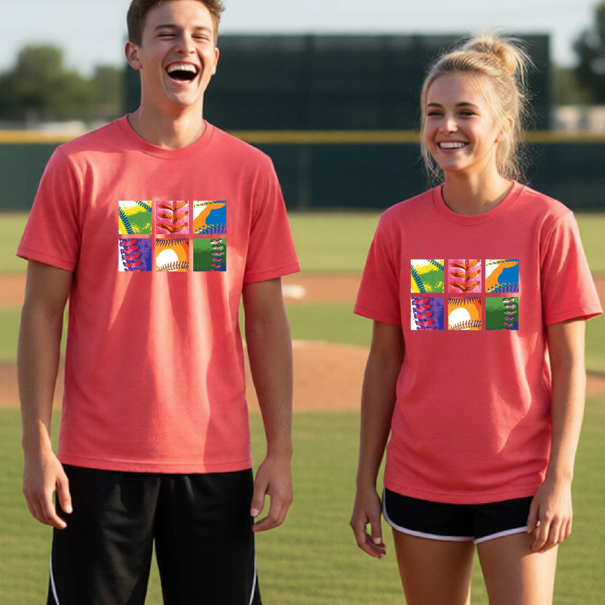 Two youth athletes wearing matching shirts, smiling in front of a baseball diamond wearing coral pink long-sleeve t-shirts with a colorful grid graphic or 2x3 baseball squares of a baseball, printed on the front.