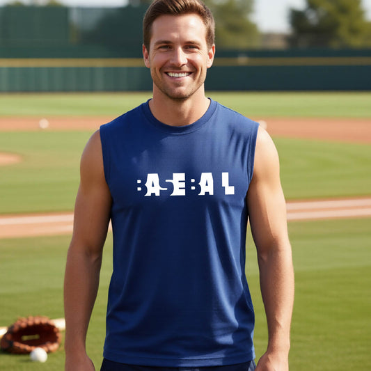 A smiling man wearing a blue sleeveless athletic shirt with the white text 'BASEBALL' in a cutout design printed across the chest, standing on a baseball field.
