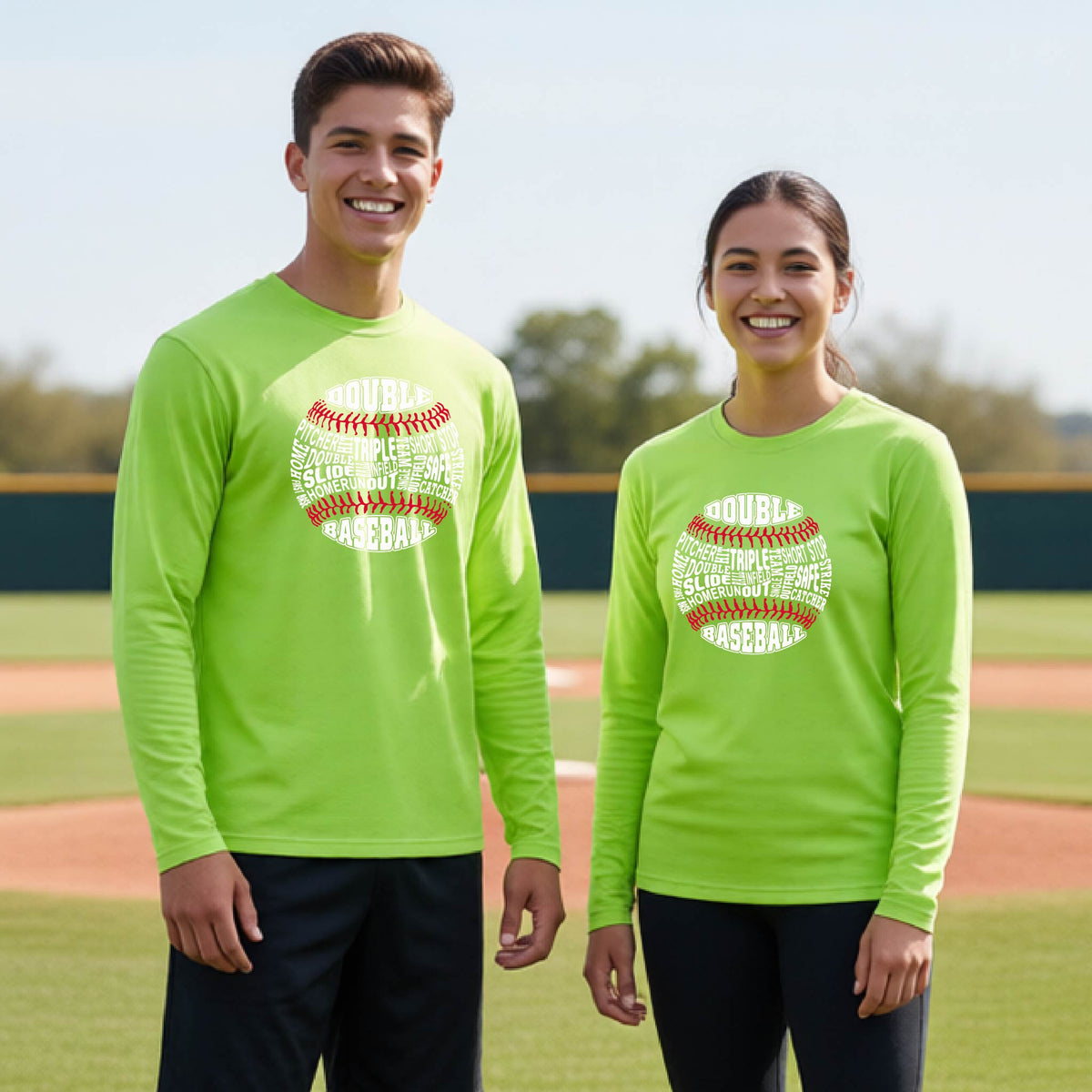 Two youth athletes wearing matching lime green long-sleeve t-shirts, smiling in front of a baseball diamond, with a white and red graphic of a baseball made up of baseball words, printed on the front of the shirt.