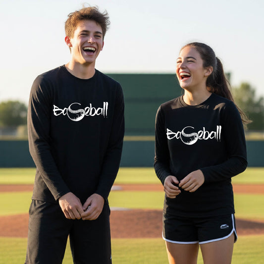 Two youth athletes wearing matching black long-sleeve t-shirts, smiling in front of a baseball diamond, with an artistic white graphic of a sketch of the word BASEBALL” in a curved font with the S replaced by a baseball, printed on the front of the shirt.