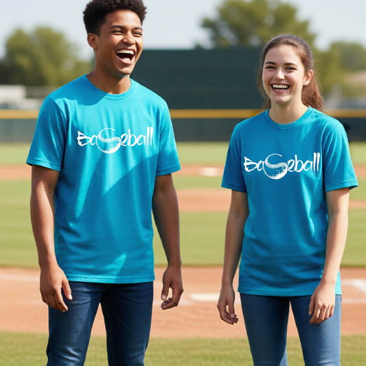 Two youth athletes wearing matching bright blue short-sleeve t-shirts, smiling in front of a baseball diamond, with an artistic white graphic of a sketch of the word BASEBALL” in a curved font with the S replaced by a baseball, printed on the front of the shirt.