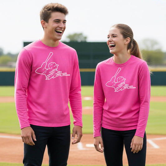 Two youth athletes wearing matching shirts, smiling in front of a baseball diamond wearing pink long-sleeve t-shirts with a white graphic of an outline of a baseball player up to bat, printed on the front.