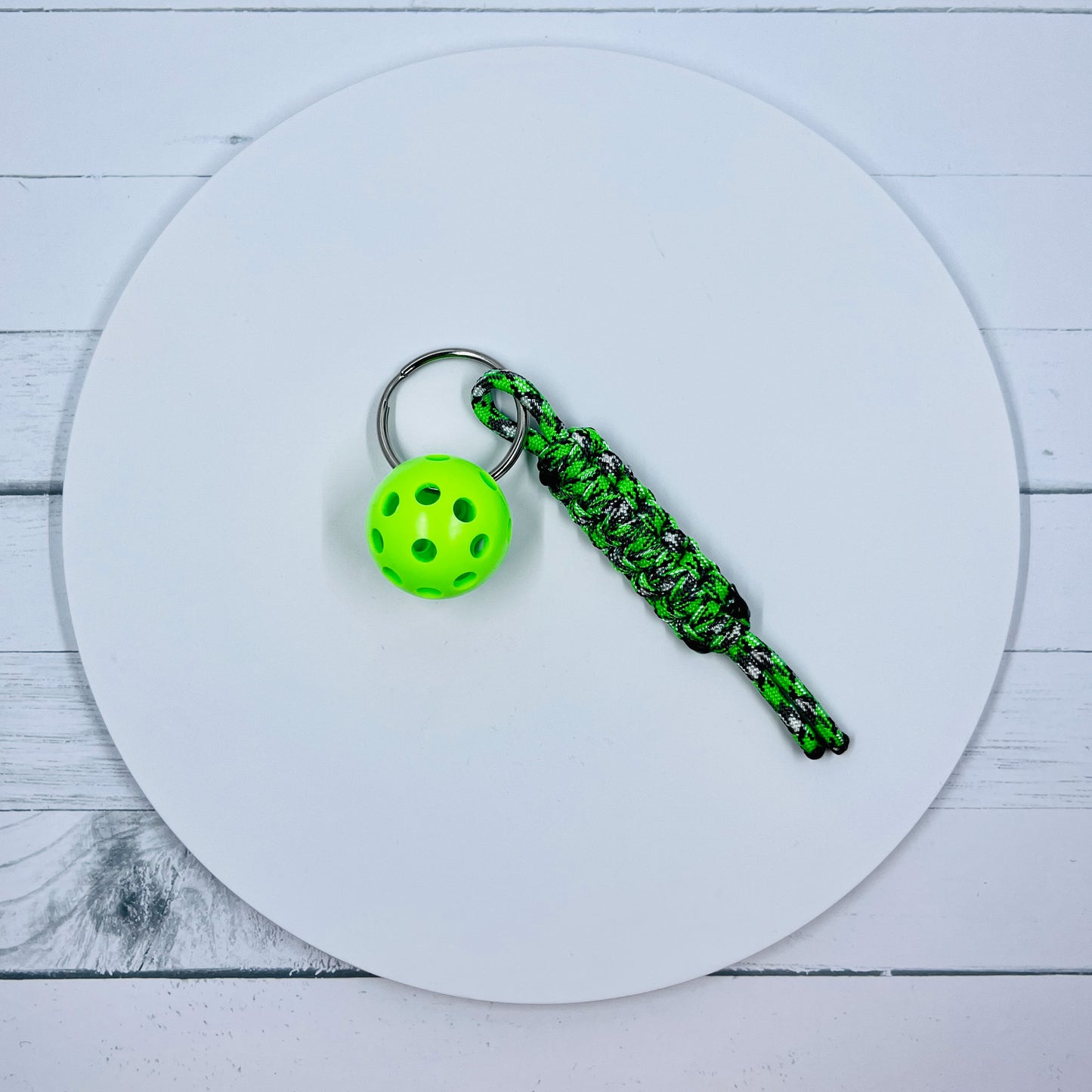 This keychains are one-a-kind. The micro pickleball balls are 1-inch in size.  They are small enough for pockets and large enough to easily find.  They are super heavy duty and guaranteed to become your favorite keychain ever.  You also get to choose the color of ball you would like.  These 4-inch key chain lanyards are smaller than our regular 6-inch keychains (measurements are approximations). 