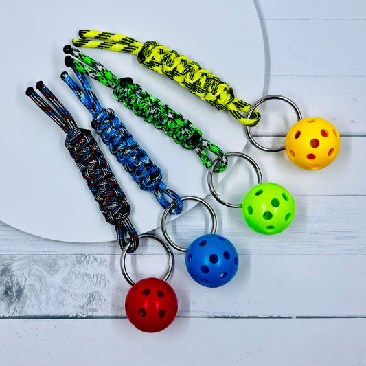 This keychains are one-a-kind. The micro pickleball balls are 1-inch in size.  They are small enough for pockets and large enough to easily find.  They are super heavy duty and guaranteed to become your favorite keychain ever.  You also get to choose the color of ball you would like.  These 4-inch key chain lanyards are smaller than our regular 6-inch keychains (measurements are approximations). 