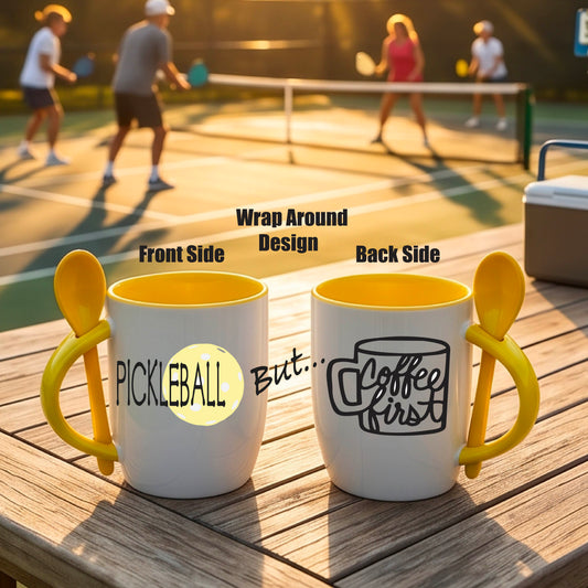 a white and yellow 12 ounce coffee mug with a built in spoon in the handle with and a fun coffee cup and pickleball graphic.