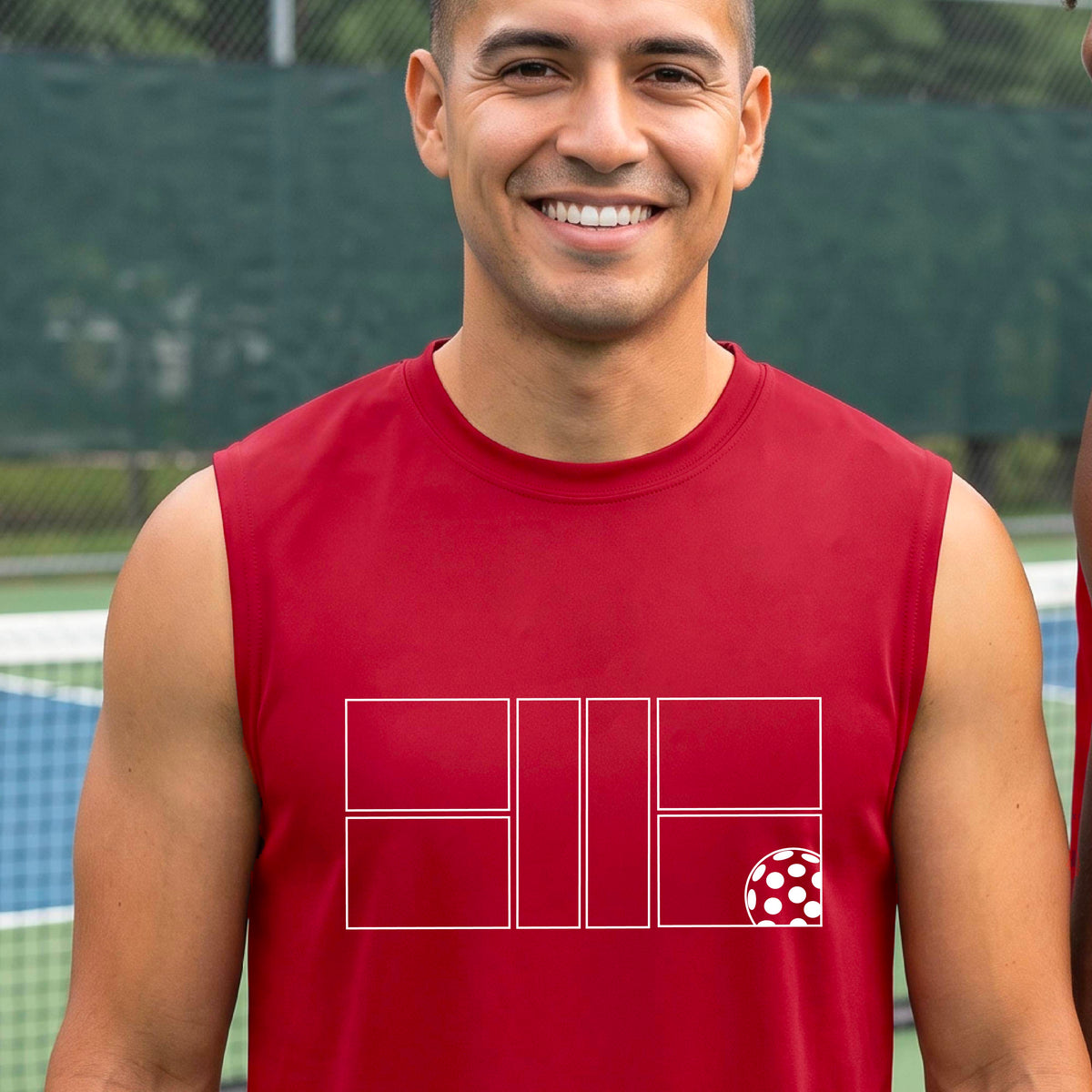 A man wearing a red sleeveless shirt with a white pickleball court and ball graphic design, standing on a pickleball court. 