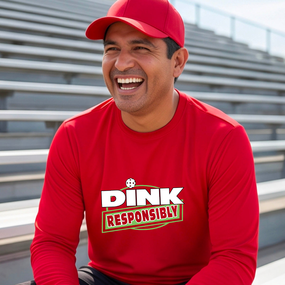 A man wearing a red long-sleeve t-shirt with a graphic that reads 'DINK RESPONSIBLY' in white and green,.