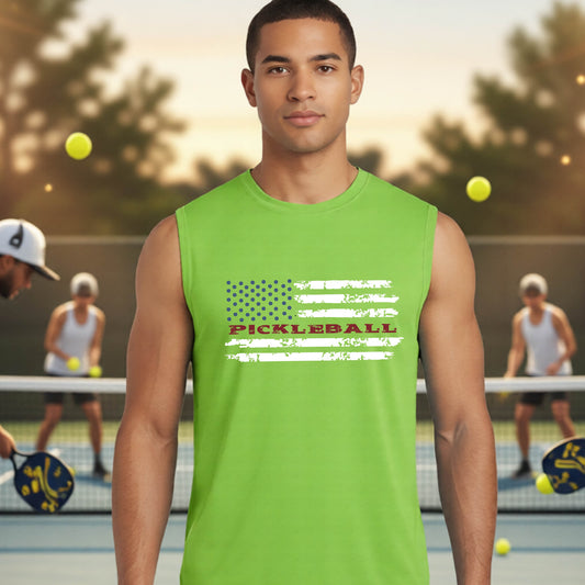 A man wearing a lime green sleeveless t-shirt with a pickleball graphic of a distressed flag made out of pickleballs and the text 'PICKLEBALL' replacing one of the stripes, standing on a pickleball court. 