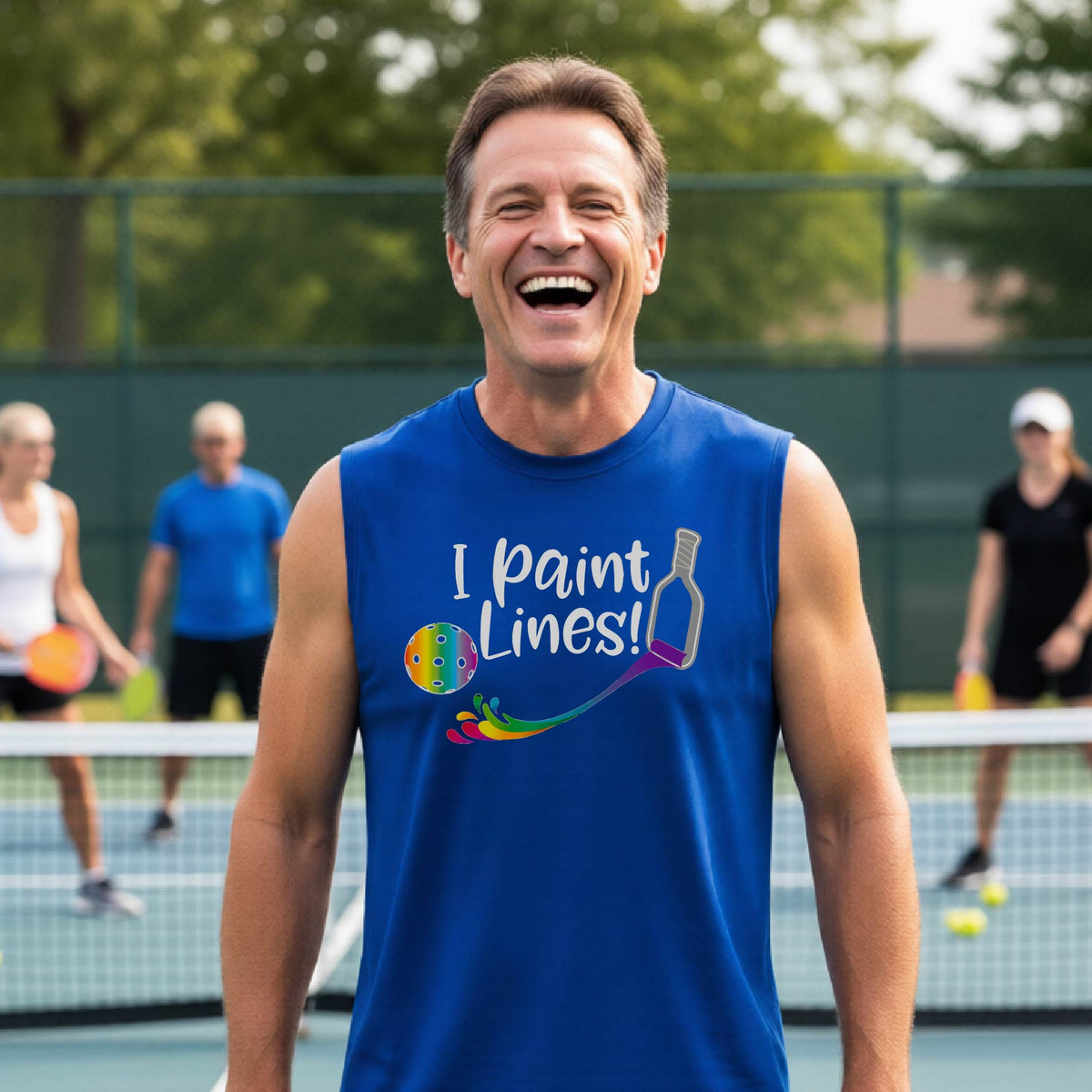 A close-up of a man wearing a coral lime royal blue sleeveless t-shirt with a graphic on the front that has white text "I PAINT LINES'  with a white pickleball paddle painting multi-colored lines leading a mutli-colored pickleball.