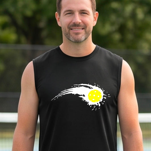 A man wearing a black sleeveless T-shirt with a white pickleball graphic of a yellow pickleball with a motion trail effect, displayed in front of a pickleball court. 