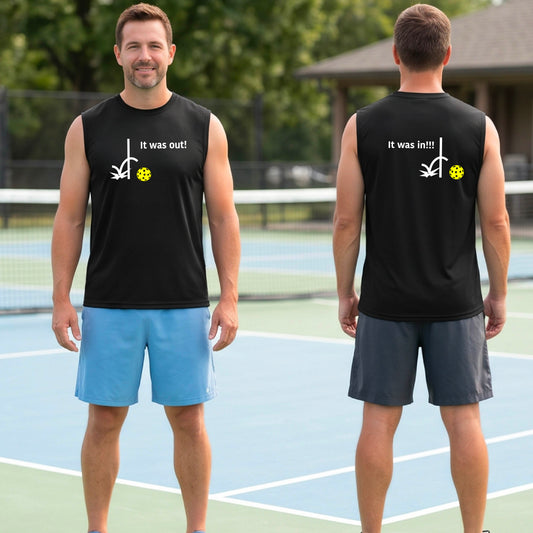 Two men showing a black sleeveless t-shirt with a white design of ‘IT WAS OUT!’ and a colorful pickleball on the front, and the back design with a white ‘IT WAS IN!!!’ and a colorful pickleball, standing on a pickleball court.