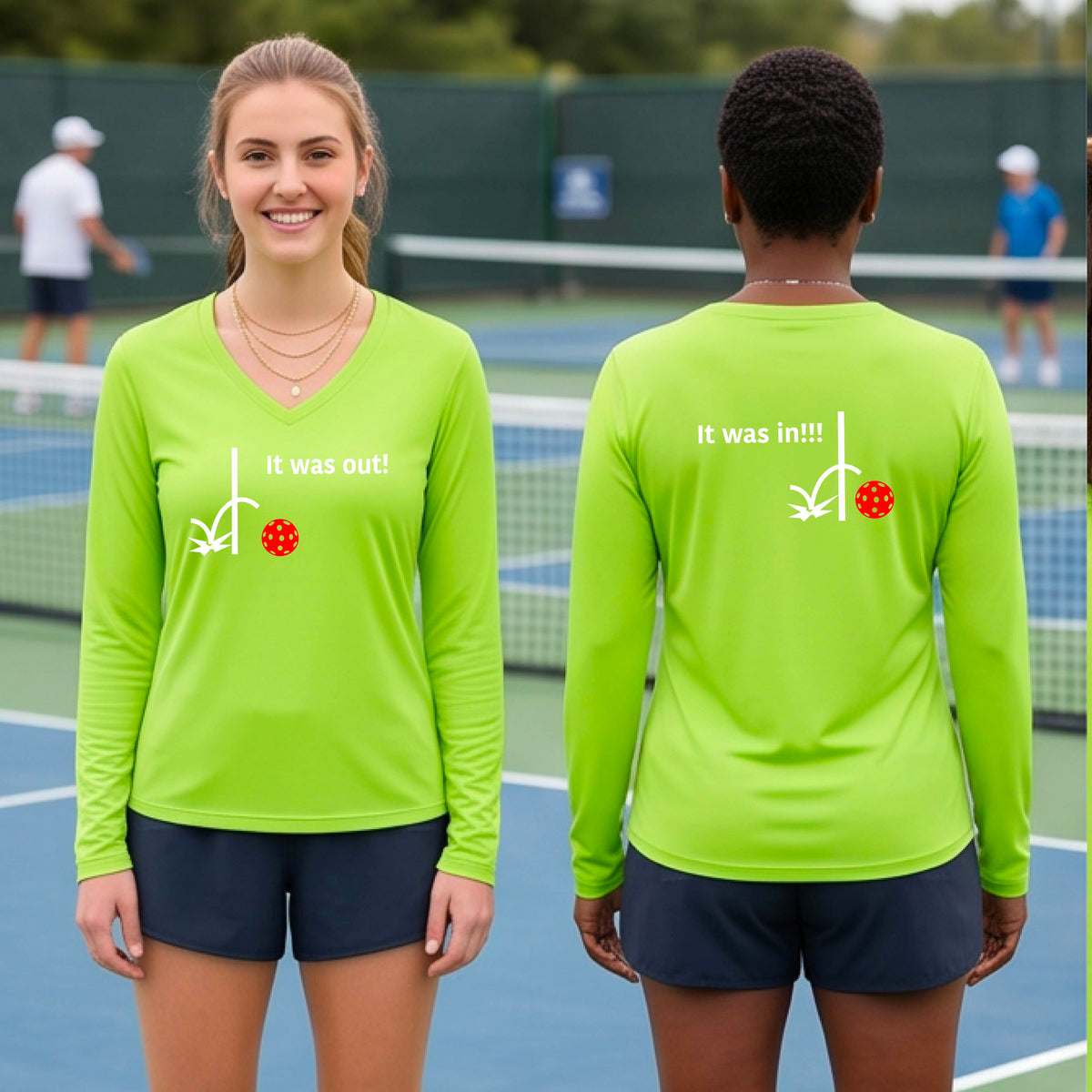 Two women wearing a lime green long-sleeve t-shirt with a white design of ‘IT WAS OUT!’ and a colorful pickleball on the front, and the back design with a white ‘IT WAS IN!!!’ and a colorful pickleball, standing on a pickleball court.