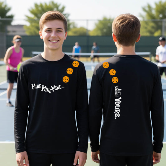 Two teenagers on a pickleball court wearing matching black athletic tank tops  One shows the front with the text 'MINE MINE MINE' along with three pickleball graphics. and the back text 'JUST KIDDING YOURS, along with three pickleball graphics.