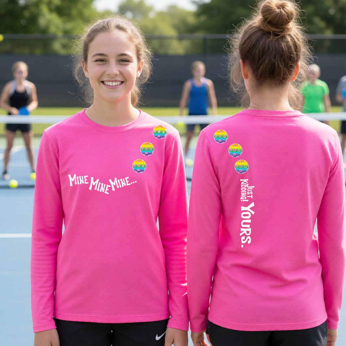 Two teenagers on a pickleball court wearing matching pink athletic tank tops  One shows the front with the text 'MINE MINE MINE' along with three pickleball graphics. and the back text 'JUST KIDDING YOURS, along with three pickleball graphics.