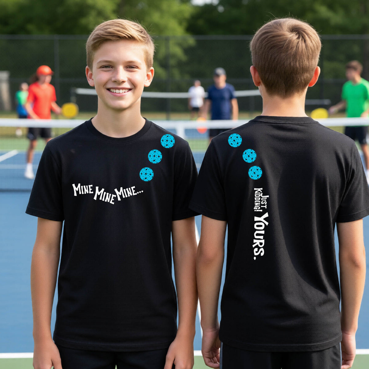 Two teenagers on a pickleball court wearing matching black athletic tank tops  One shows the front with the text 'MINE MINE MINE' along with three pickleball graphics. and the back text 'JUST KIDDING YOURS, along with three pickleball graphics.