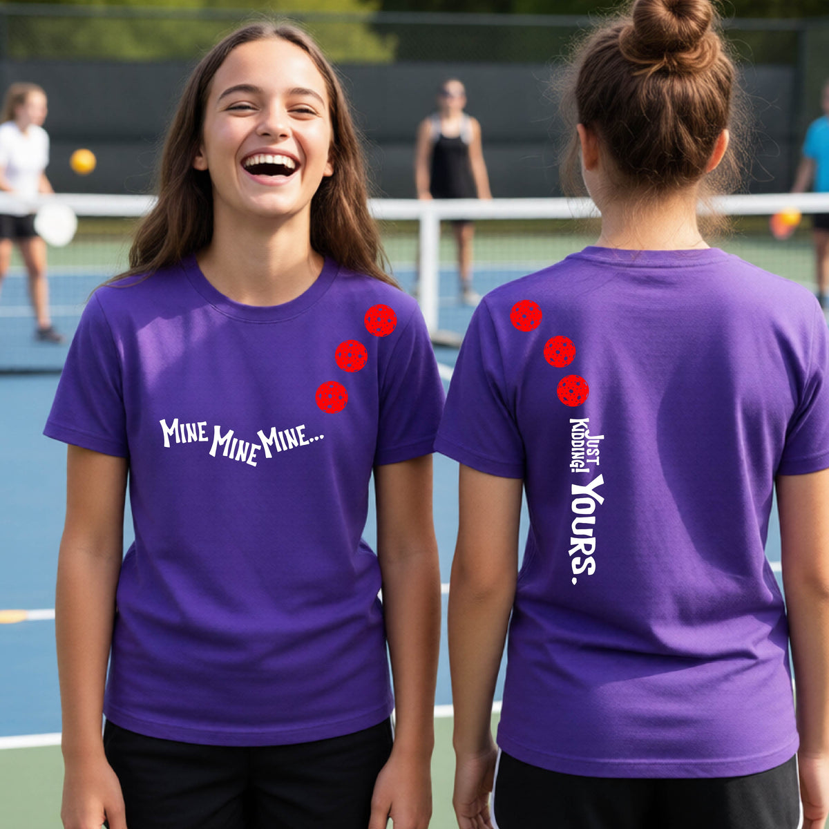 Two teenagers on a pickleball court wearing matching purple athletic tank tops  One shows the front with the text 'MINE MINE MINE' along with three pickleball graphics. and the back text 'JUST KIDDING YOURS, along with three pickleball graphics.