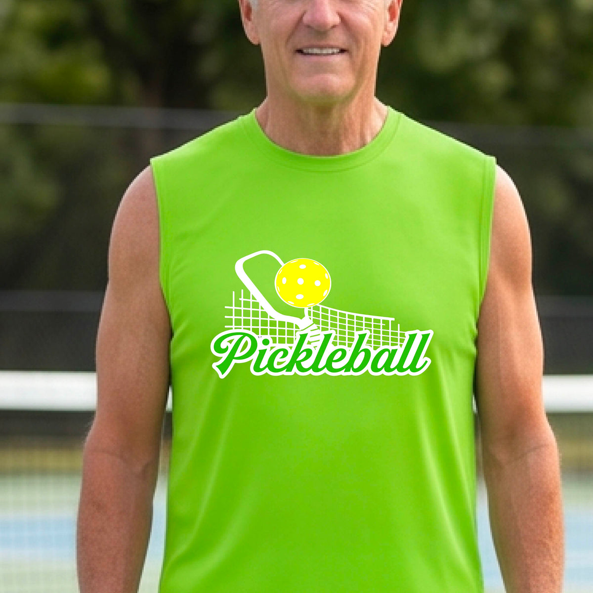 A man wearing a lime green sleeveless t-shirt with a graphic on the front that has white and green text "PICKLEBALL'  with a white pickleball paddle and net and a yellow pickleball above the text graphic.