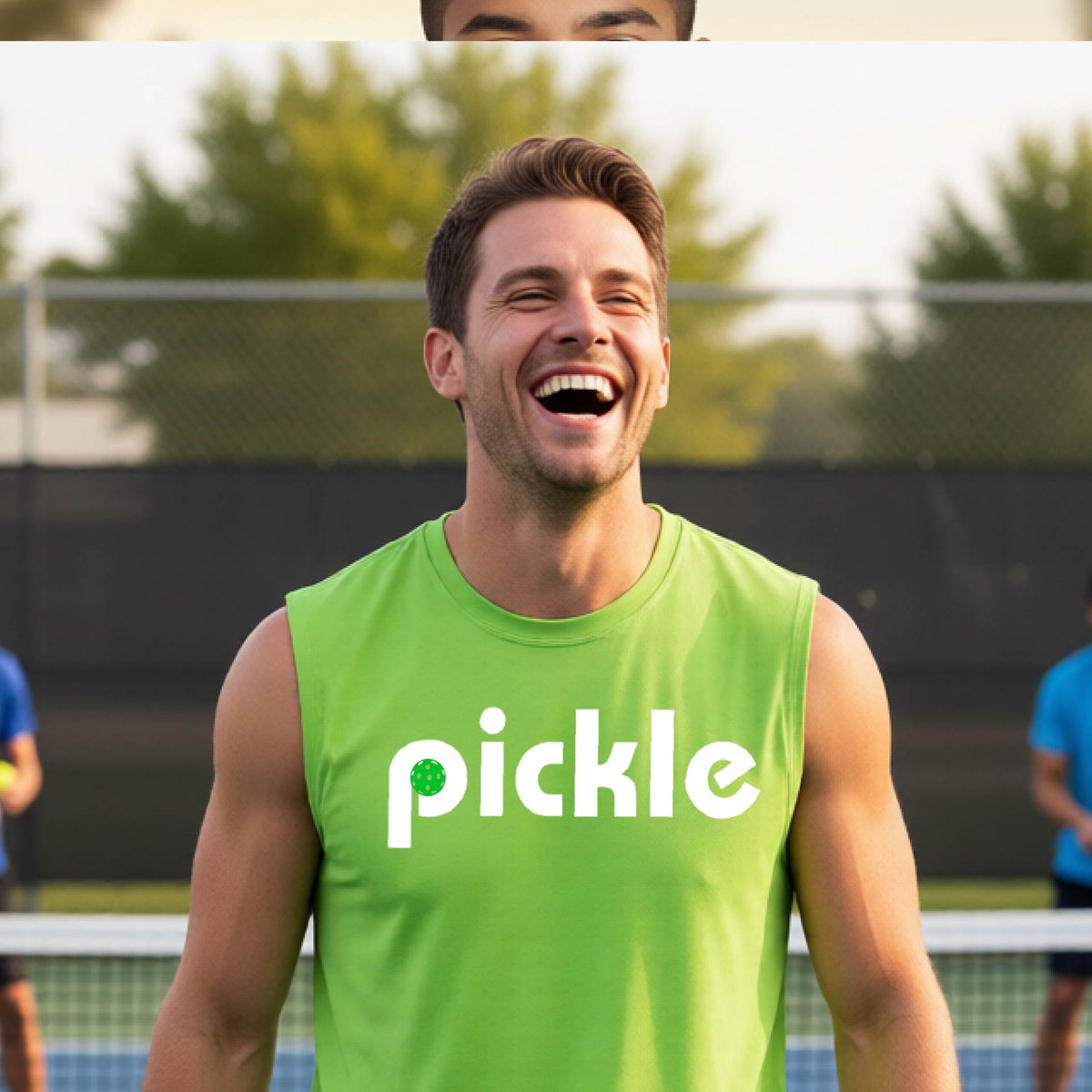 A man wearing a lime green sleeveless t-shirt with a white graphic of ‘PICKLE’ with a green pickleball integrated into the letter P printed on the front, in front of a pickleball court. 