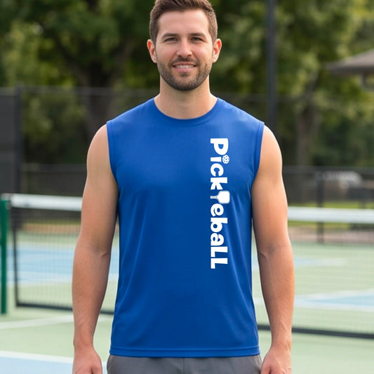A man standing on an outdoor pickleball court wearing a royal blue sleeveless athletic shirt with 'Pickleball' printed vertically in white on the front.