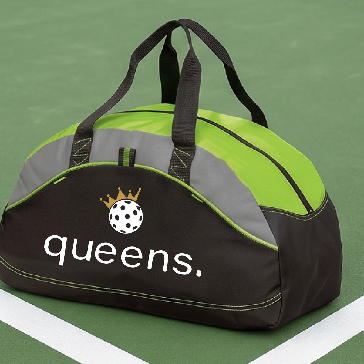 A custom black and lime green duffel bag with gray panels, featuring the word 'queens.' and a gold crown, and a white pickleball logo on the front.