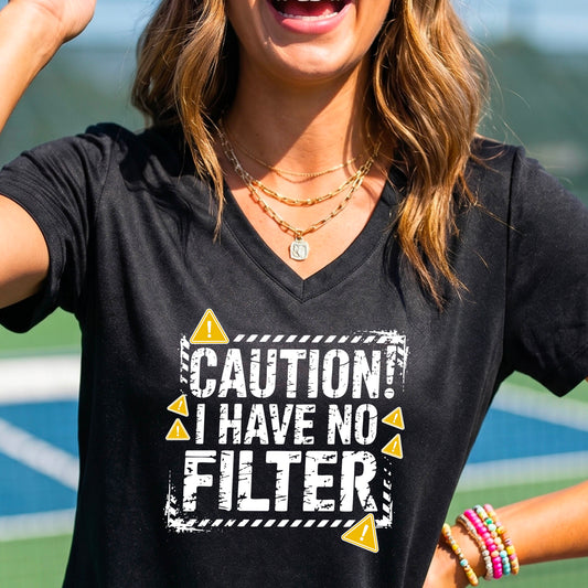 Women’s “Caution – I have no filter” black short-sleeve v-neck graphic t-shirt modeled in an outdoor setting.