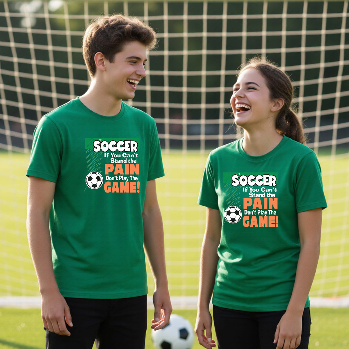 Two young students standing on a soccer field in front of a goal, wearing matching bright green graphic t-shirts with the text 'SOCCER If You Can't Stand The PAIN Don't Play The GAME!' and a soccer ball graphic.