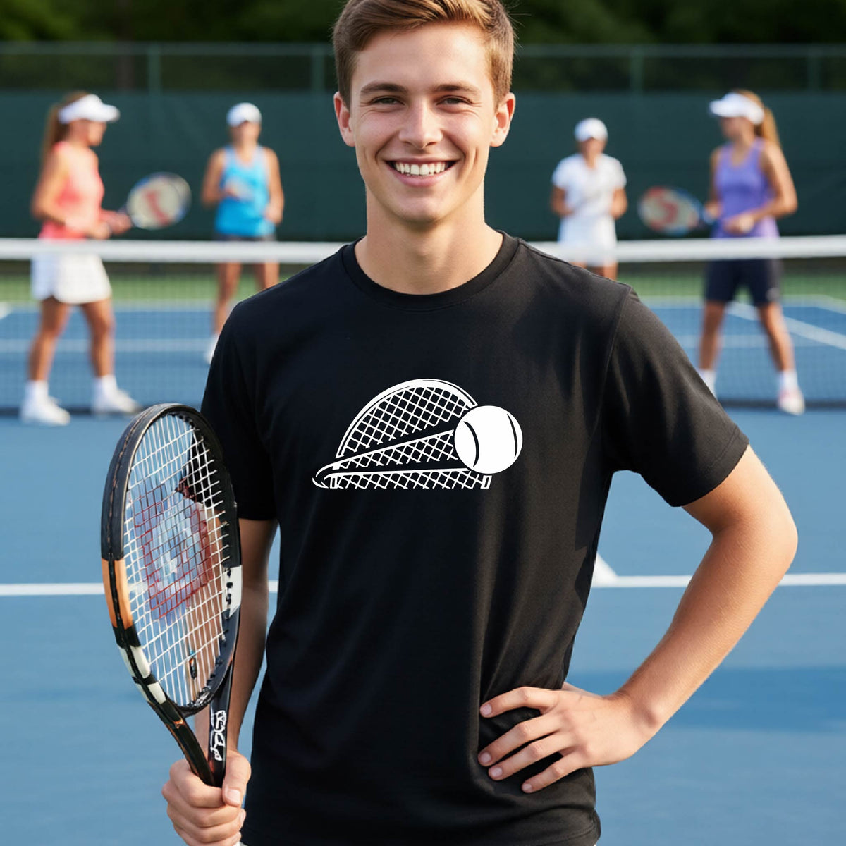 A young person  on a blue tennis court holds a tennis racket and wears a black short-sleeve T-shirt with a white graphic of a half a tennis racquet with a ball streaking over it. 