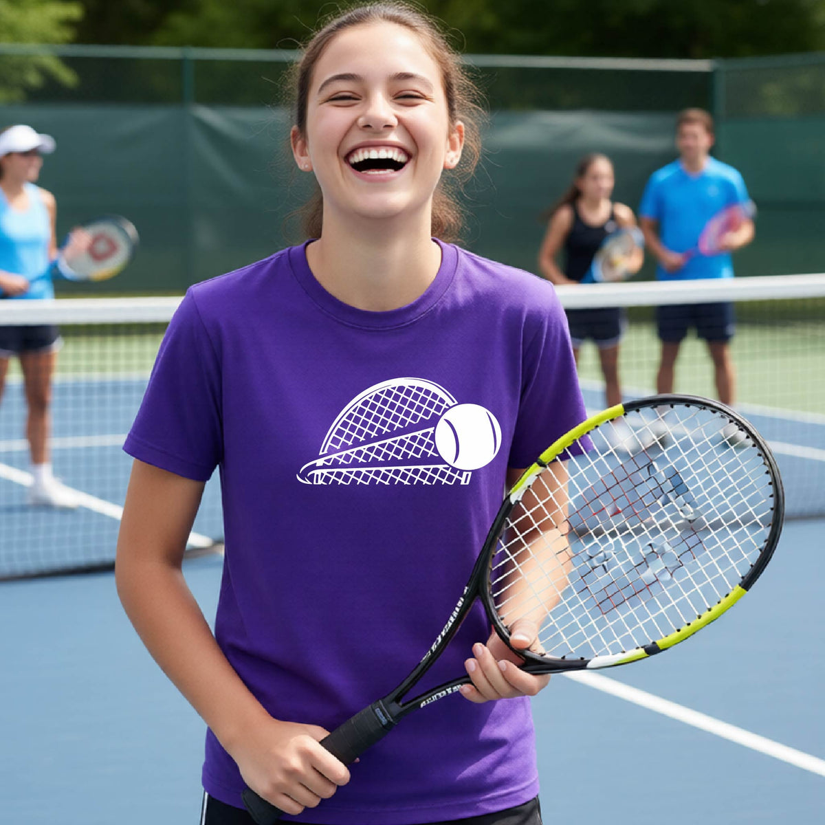 A young person  on a blue tennis court holds a tennis racket and wears a purple short-sleeve T-shirt with a white graphic of a half a tennis racquet with a ball streaking over it. 
