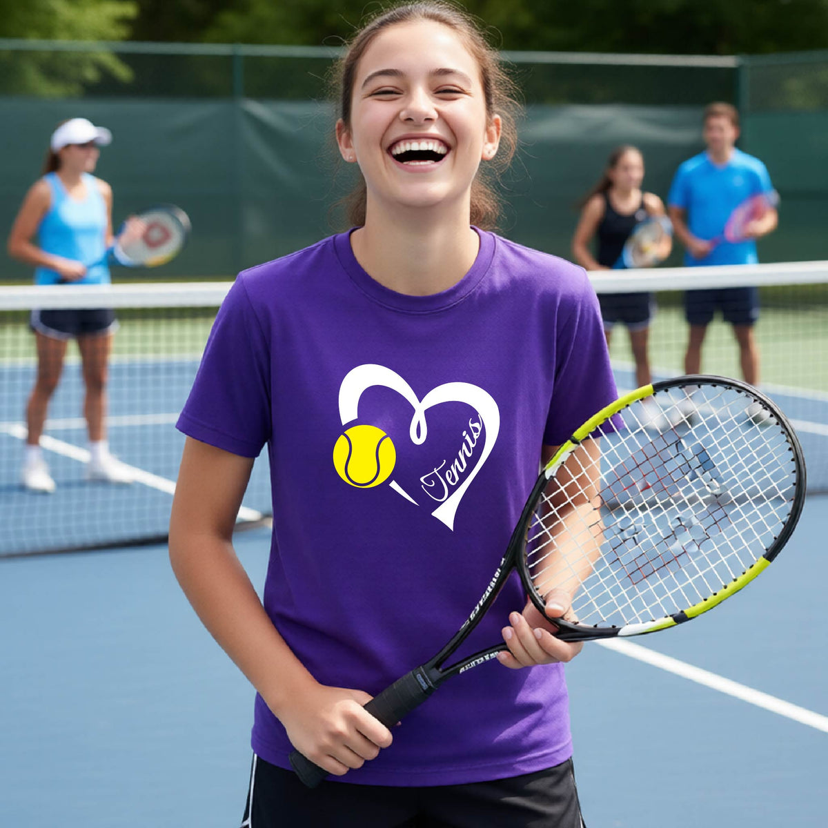 A young girl smiling on a tennis court wearing a purple t-shirt with a white heart, yellow tennis ball, and the name 'Tennis' printed on the front. She is holding a tennis racket.