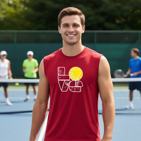 A man wearing a red sleeveless t-shirt with a white and yellow tennis-themed graphic "LOVE" with a tennis ball replacing the O, with a tennis  court and players in the background.