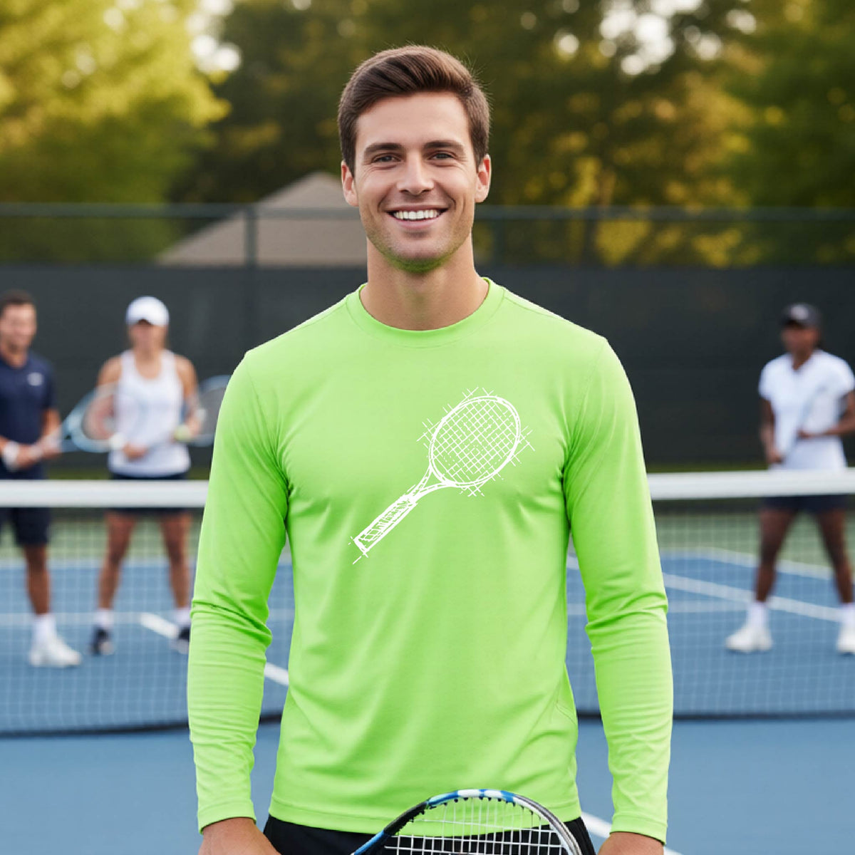 A man on a blue tennis court holds a tennis racket and wears a lime green long-sleeve T-shirt with a white retro tennis racquet graphic.  