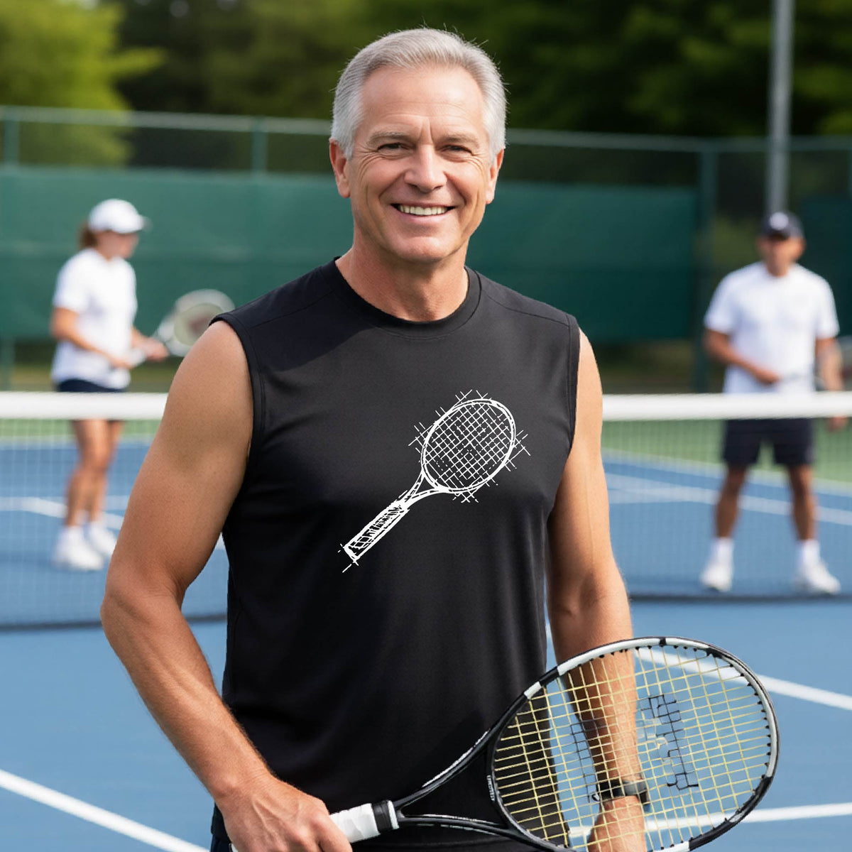 A smiling young man on a blue tennis court holds a tennis racket and wears a black T-shirt with a white retro tennis racquet graphic