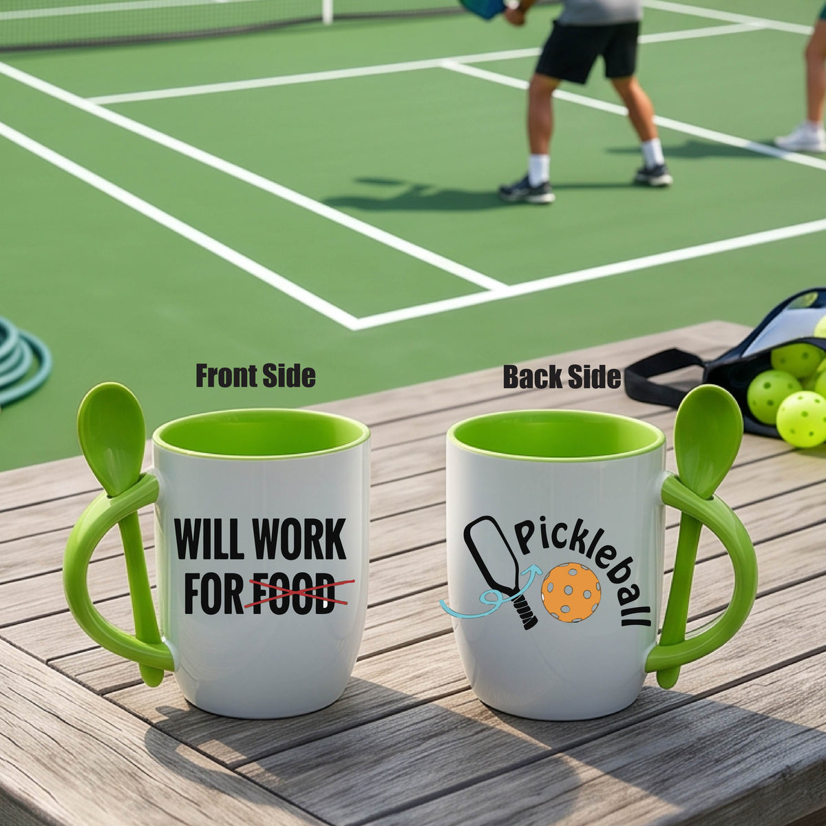 a white and green 12 ounce coffee mug with a built in spoon in the handle with the wraparound text 'WILL WORK FOR FOOD" and a pickleball paddle and ball graphic.