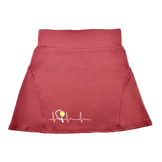 Pickleball Flirty Skort Design:  Pickleball Heartbeat  These flirty skorts have a flat mid-rise waistband with a 3 inch waistband.  Light weight without being see through and the material wicks away moisture quickly.  Flirty pleats in the back with inner shorts for free movement and stylish coverage on the courts.  A functional zipper pocket on the back and two built in pockets on the shorts for convenient storage.