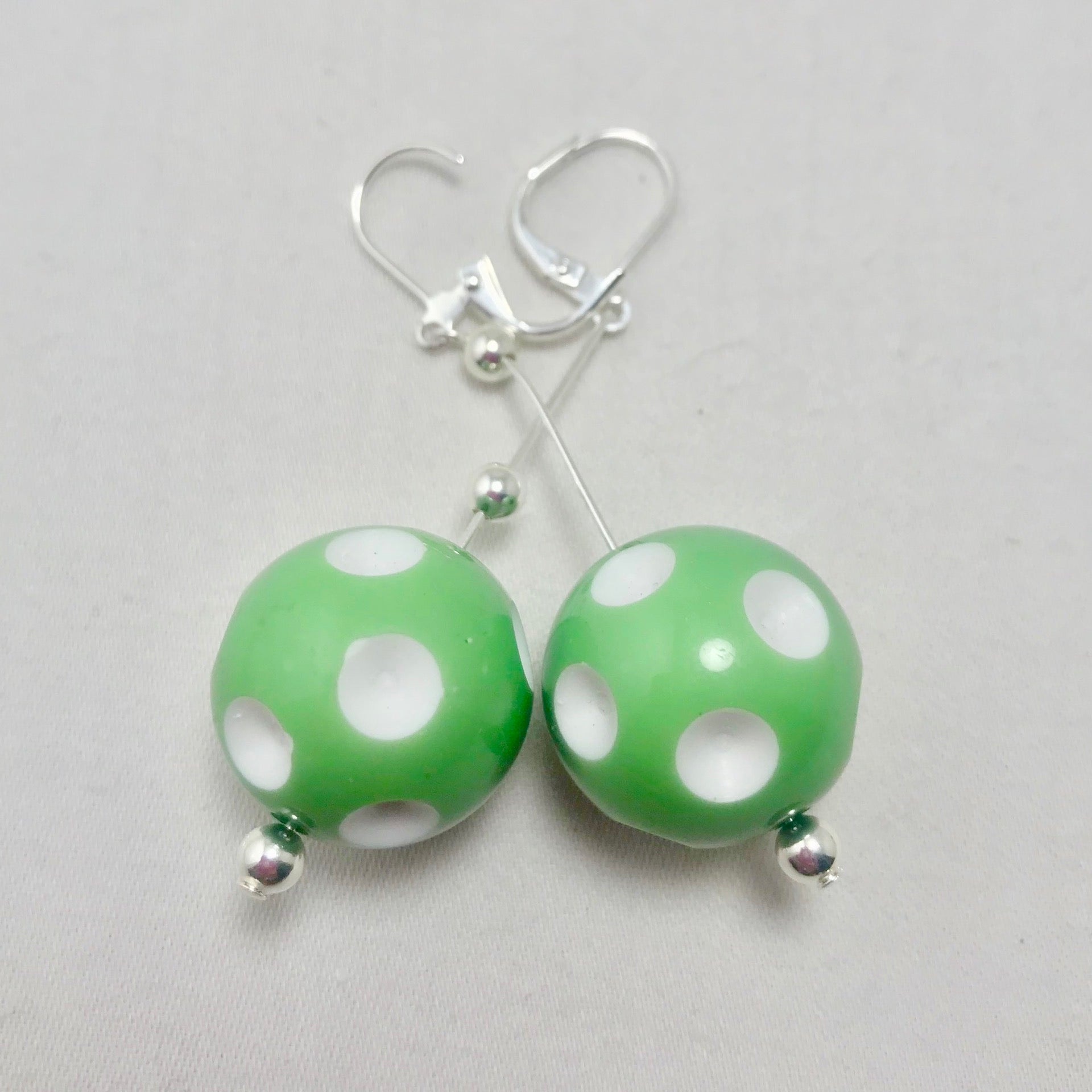 Mini Pickleball Dangling Earrings - Eight Colors to Choose From  Super cute pickleball beads made into dangle earrings. They hang approximately an 2 and a half inches down. The beads are approximately 1/2 an inch in width.  Show your love for pickleball wherever you go with these super sweet earrings. Colors to match any outfit!! 