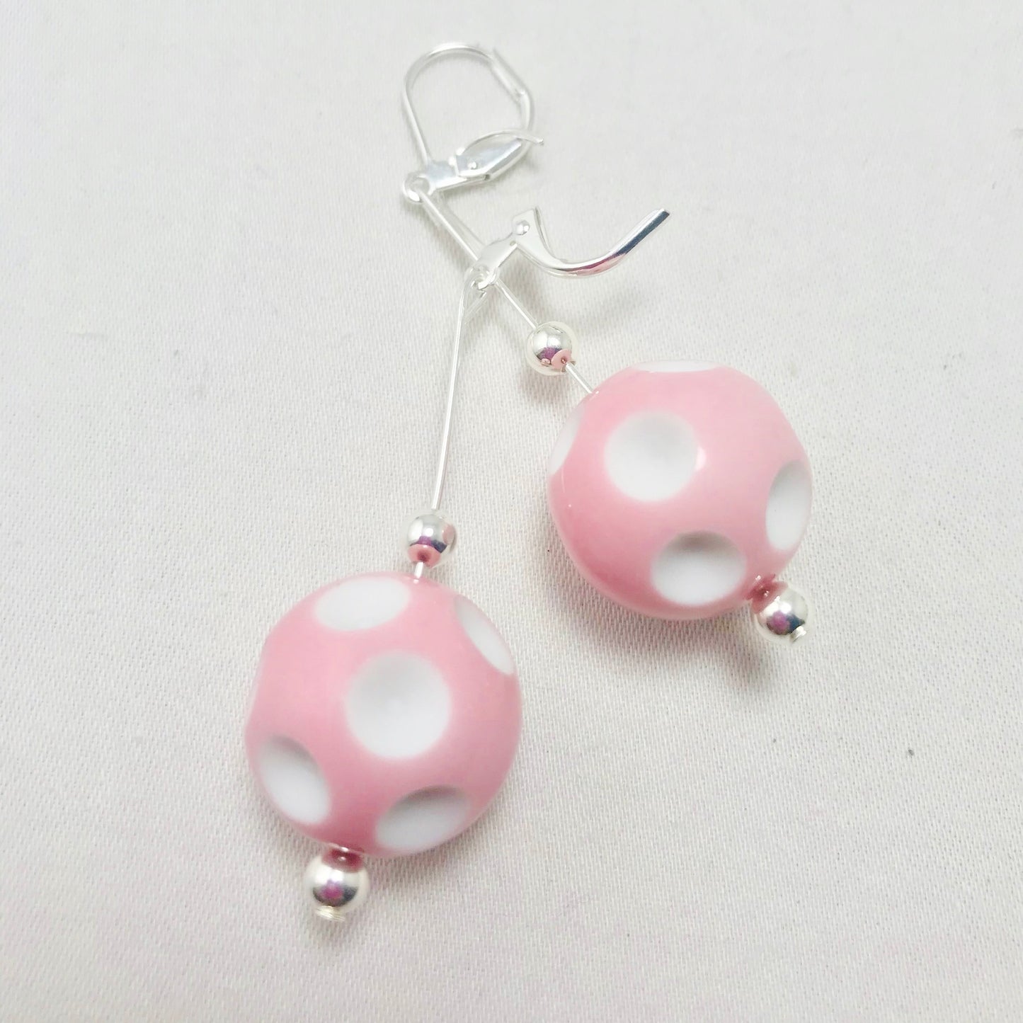 Mini Pickleball Dangling Earrings - Eight Colors to Choose From  Super cute pickleball beads made into dangle earrings. They hang approximately an 2 and a half inches down. The beads are approximately 1/2 an inch in width.  Show your love for pickleball wherever you go with these super sweet earrings. Colors to match any outfit!! 