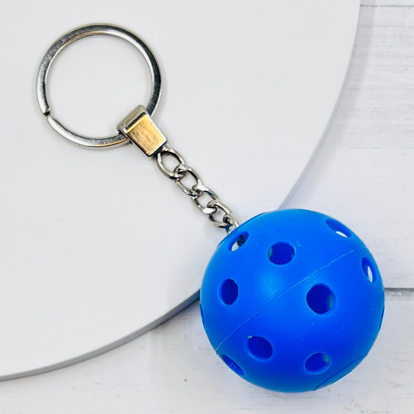 Heavy Duty Mini Pickleball Bag Tags/Pulls  Each order gets you 1 of the cutest pickleball and heavy duty chains! The Mini pickleballs measure about 1 1/2 inches and are used as bag tag markers. Fun for any bag, especially your pickleball bag!! The balls come in 7 colors: Red, Green, Blue, White, Pink, Orange, and Yellow. Choose from 7 fun colors.