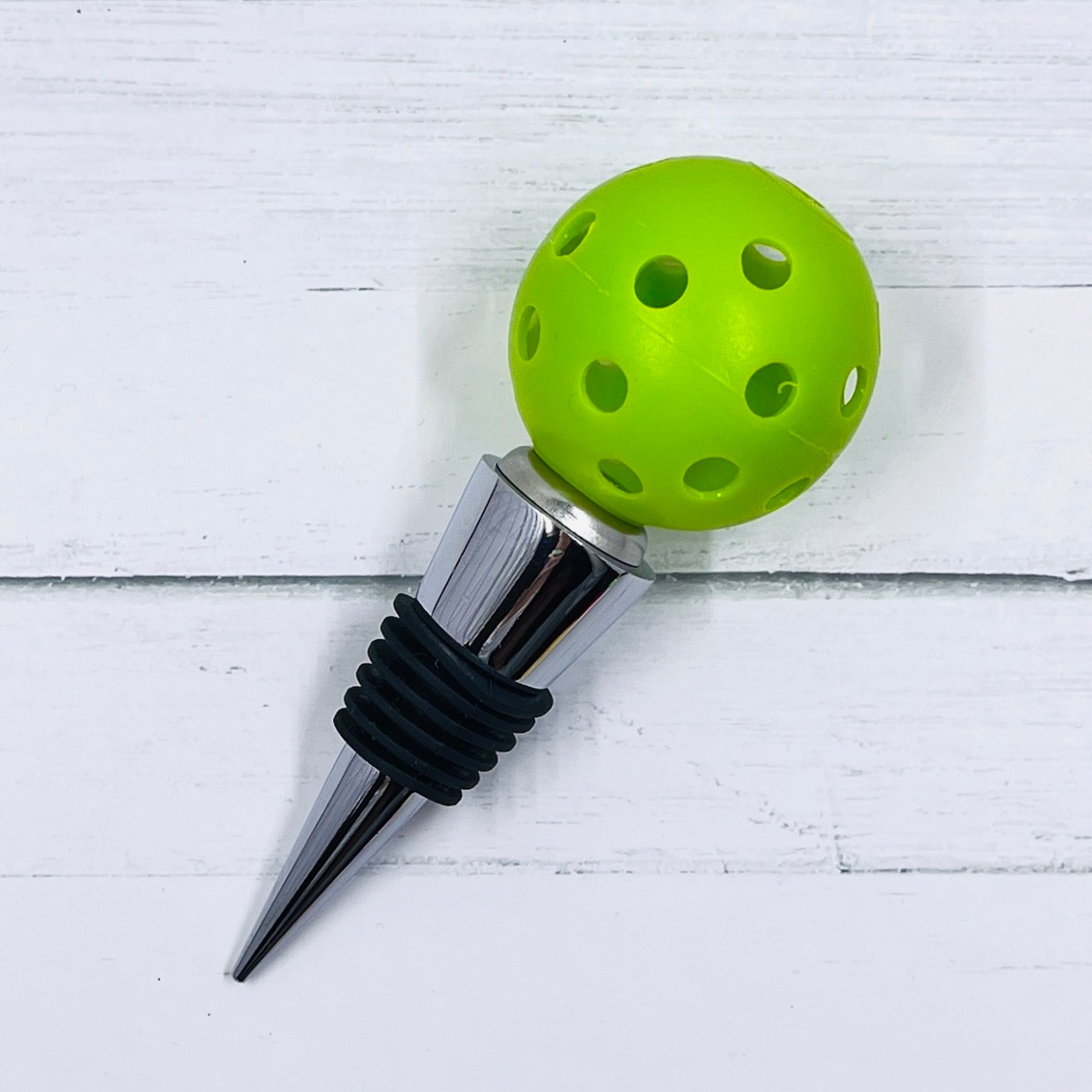 Pickleball Wine Bottle Stopper - Well-Made and Very Sturdy - Perfect Gift  These sturdy well-made wonderful pickleball wine bottle stoppers are the perfect gift for all your like-minded friends or splurge and treat yourself - YOU DESERVE IT! Each order contains one wine bottle stopper. You get to choose the color. 