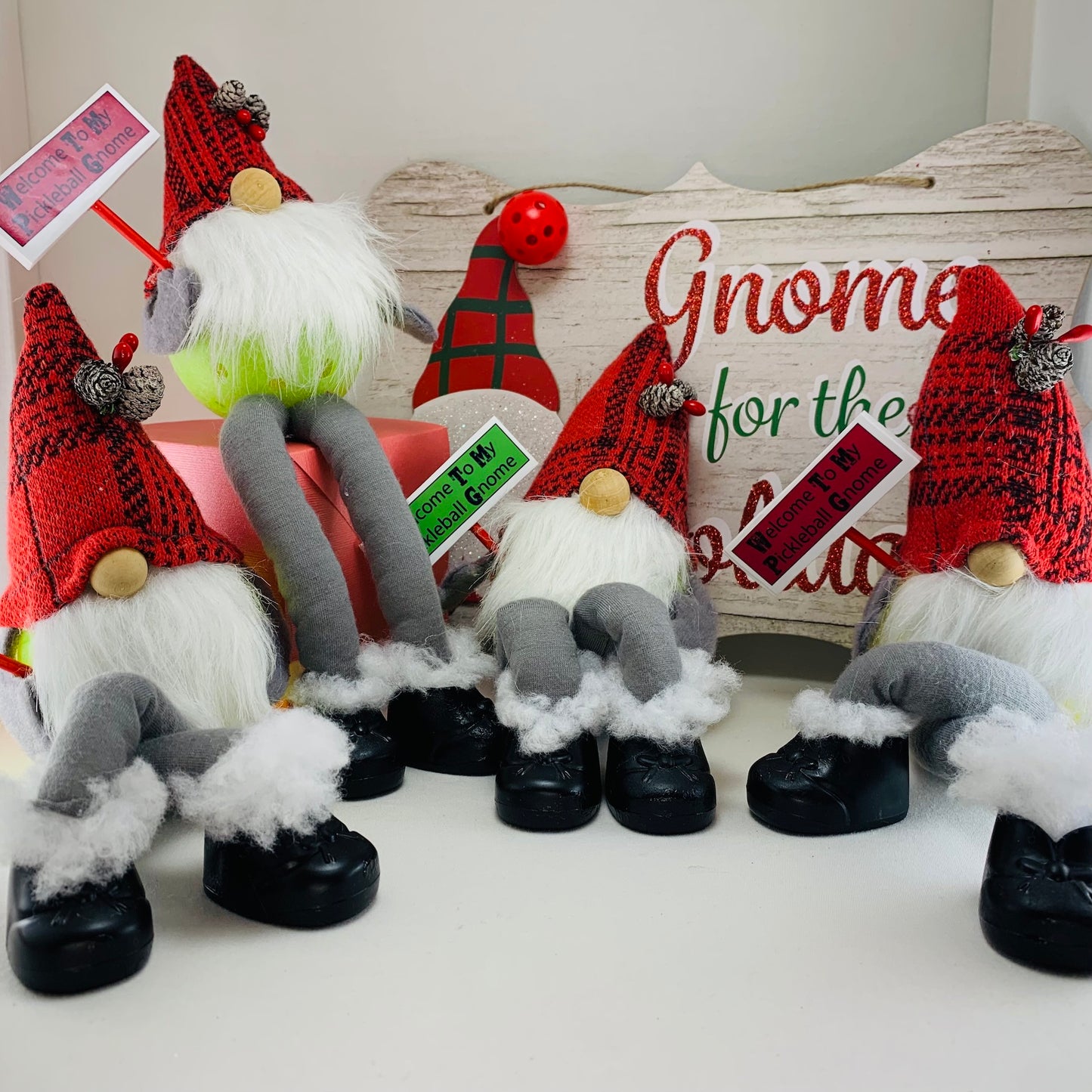 WELCOME HOME PICKLEBALL SITTING GNOME FOR THE HOLIDAY SEASON - DECORATION OR GIFT  These pickleball gnomes are perfect for decoration or gifts for your pickleball addicted friends. Each Pickleball Gnome's body is an upcycled full-sized pickleball with a sign welcoming those to your home!! These Gnomes are the perfect gifts for all you pickleball lovers in your life!! Adding a Pickleball Gnome to your house only makes it better.