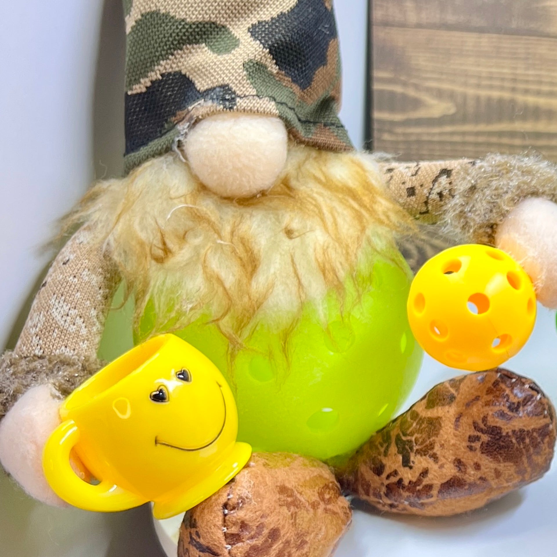 LARGE CAMO & COFFEE PICKLEBALL GNOME DECORATION AND GIFT!!  These large-sized pickleball gnomes are perfect for decoration or gifts for your pickleball addicted friends. Each Gnome is free-sitting and has a coffee cup for enjoyment. Adding a Pickleball Gnome to your house only makes it better.
