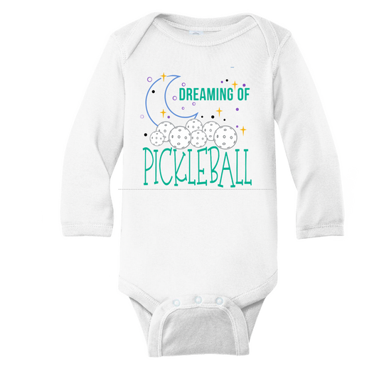 Pickleball Design: Dreaming of Pickleball  It’s a family affair! Show your love with these cute “Onesies” designed for the pickleball addict’s newest addition to the family. These unique designs are sure to please the fussiest of babies, parents and grandparents. Makes a perfect shower gift, birthday gift or just because gift.