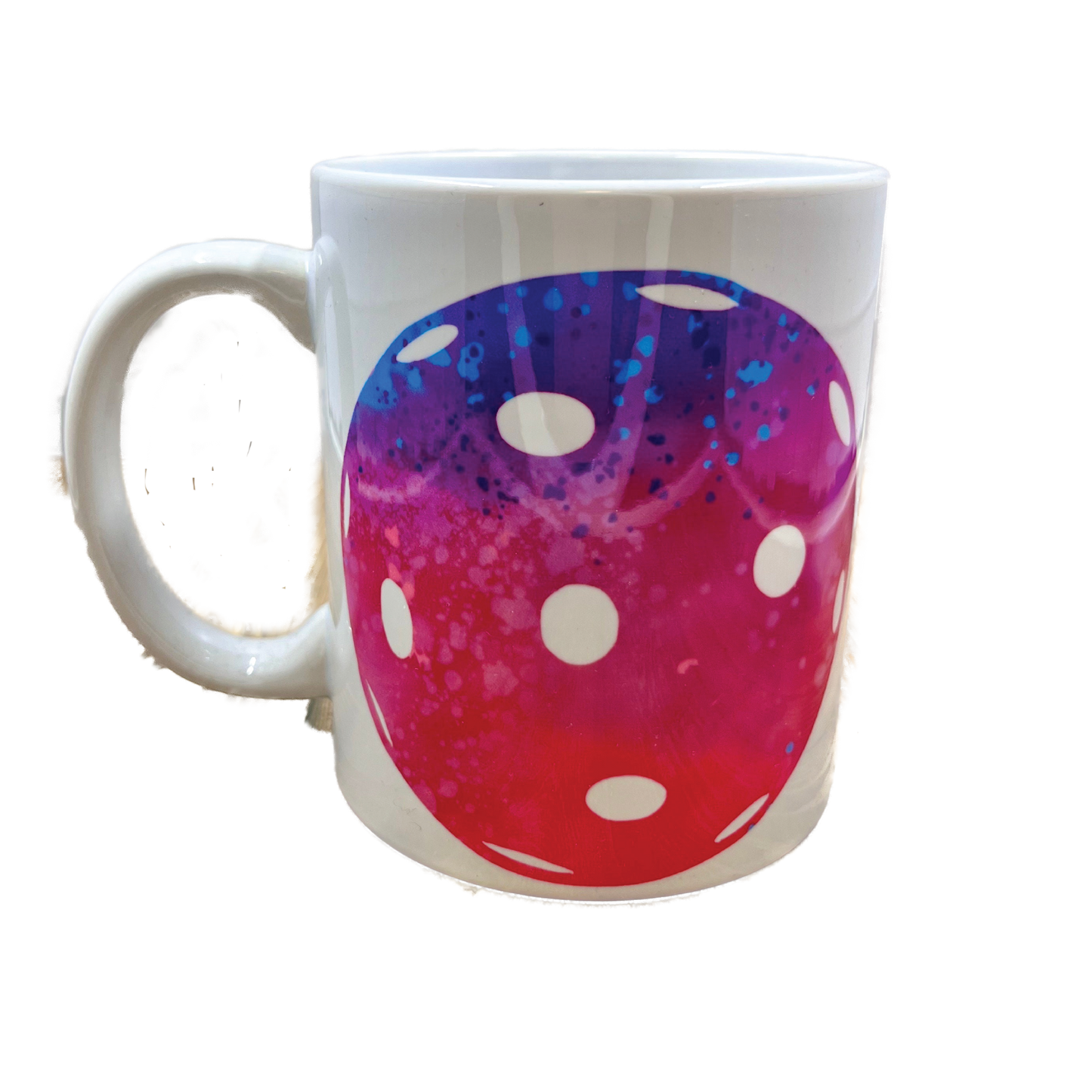 Pickleball on Coffee Mug  Greetings! What you see here is a listing for a mug that has a large pickleball on it. It comes with 1 of 4 colors for the pickleballs (Diamond plate, Harringbone pattern, Pink, and Galactic). Design is printed around the whole mug.  This is a high-quality, white, 12 oz, ceramic mug. For the longevity of the mug, hand wash only.