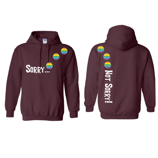 Design: Sorry...Not Sorry!!! with Customizable Ball Color: Choose: Cyan, Orange, Purple or Rainbow Unisex Hooded Sweatshirt: Moisture-wicking, double-lined hood, front pouch pocket. This unisex hooded sweatshirt is comfortable and soft. Stay warm on the Pickleball courts while being that hit with this one of kind design.